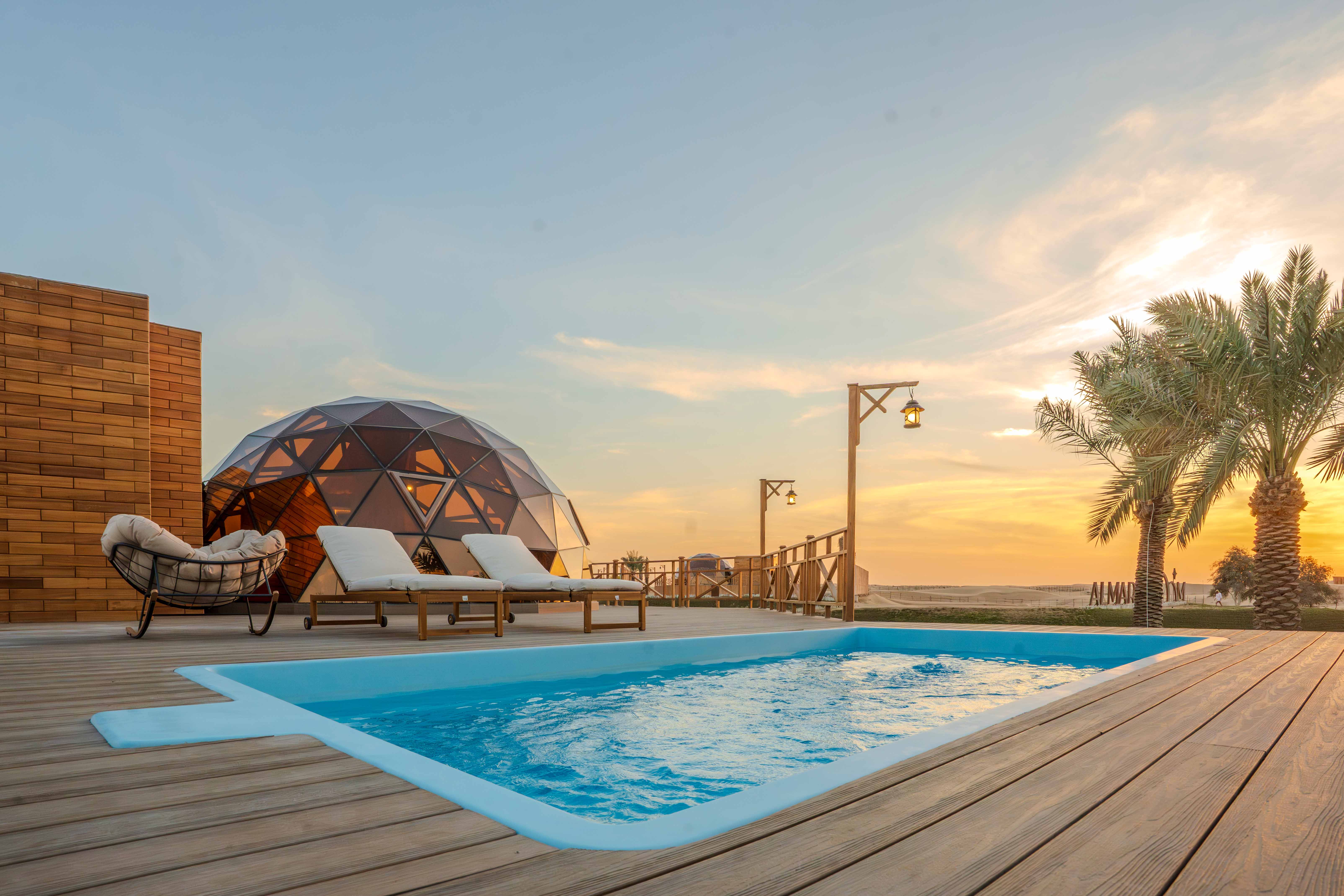 Pool view at Al Marmoom Domes overlooking the desert